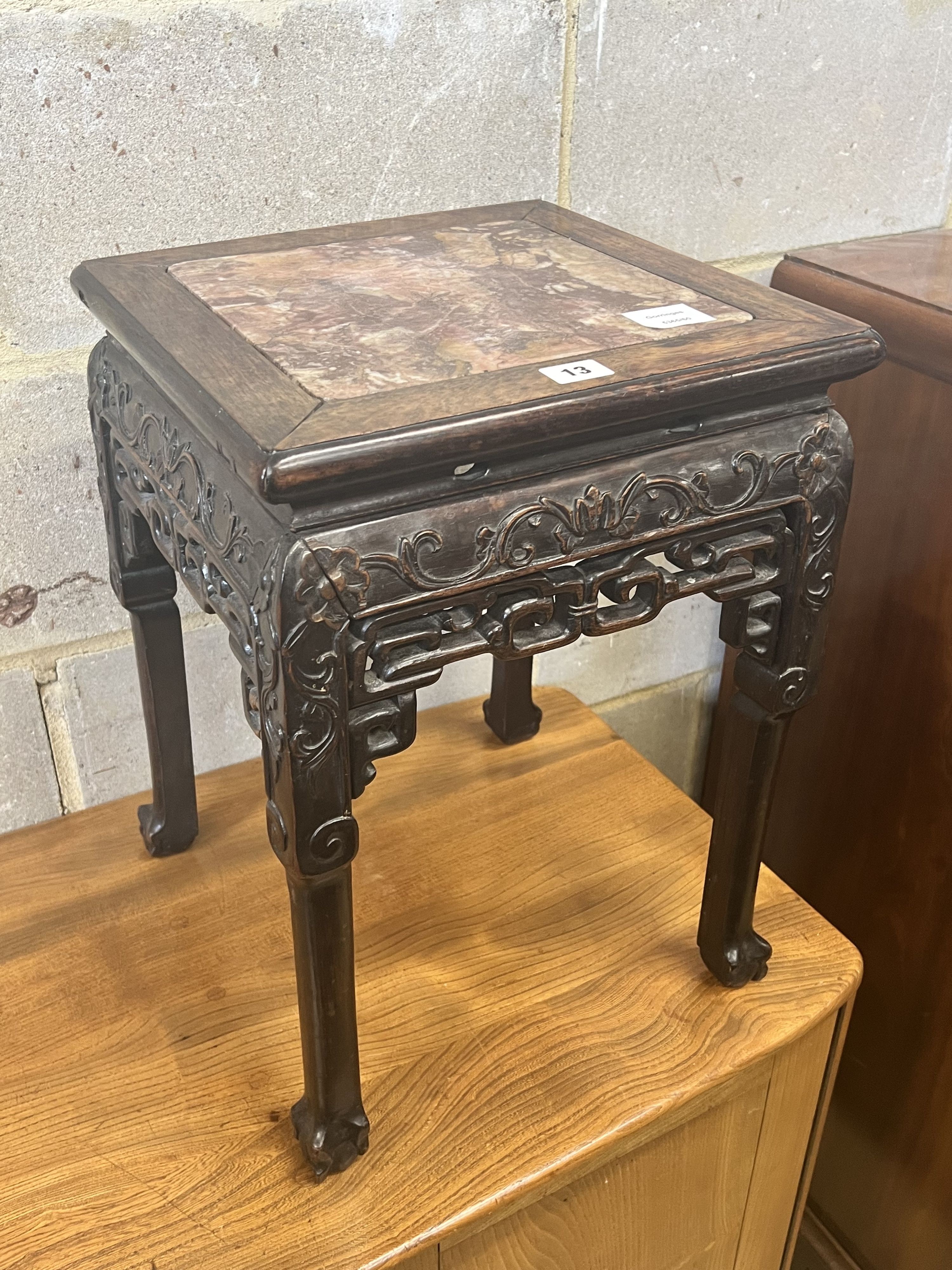 A Chinese marble topped carved hardwood jardiniere stand, width 35cm depth 35cm height 47cm
